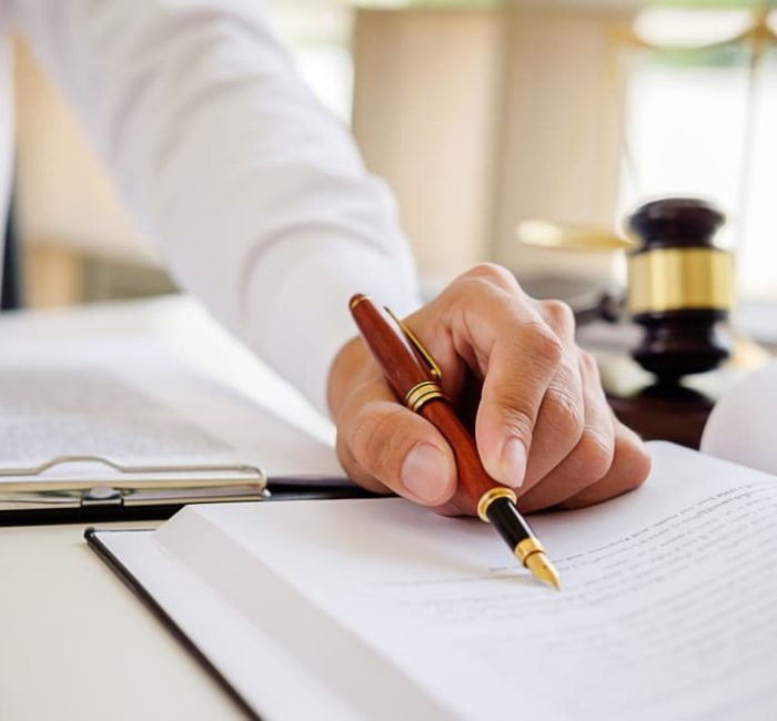 Lawyer Using Ballpoint Pen — Law Firm in Coffs Harbour, NSW